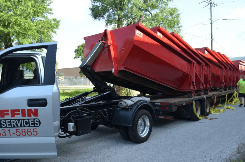 Many roofing dumpsters in Seminole Heights, FL.