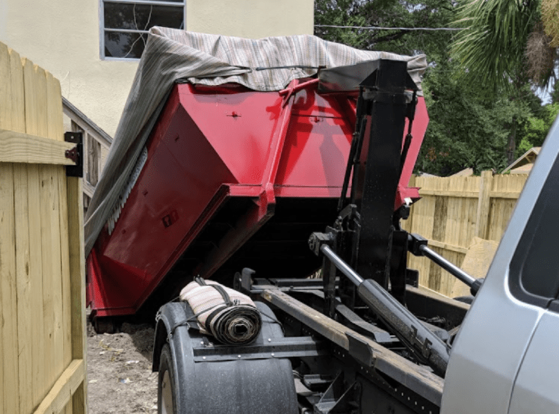 Truck with a dumpster in Clearwater, FL.