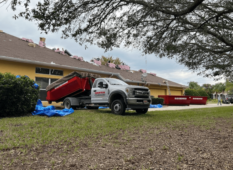 Truck picking dumpsters from Griffin Waste Services